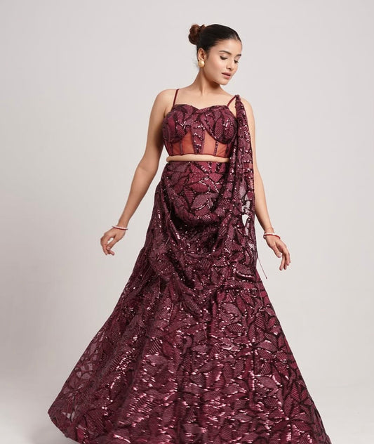 BURGUNDY COLORED SAREE WITH SEQUIN EMBROIDERY.